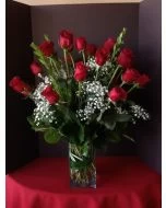 2 dozen red roses in a square vase