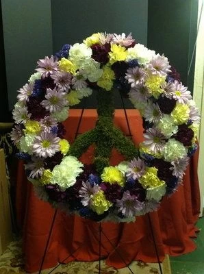 Funeral flowers peace sign