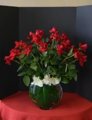 Two Dozen Roses in a Half Moon Vase
