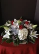 Christmas centerpiece, christmas flower arrangement, table top, holiday flowers with hydrange roses orchids and lilies
