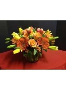 Lilies, roses and gerber daisies flower arrangement