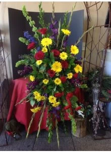Colorful Funeral Flowers with Yellow Daisies and Red Roses